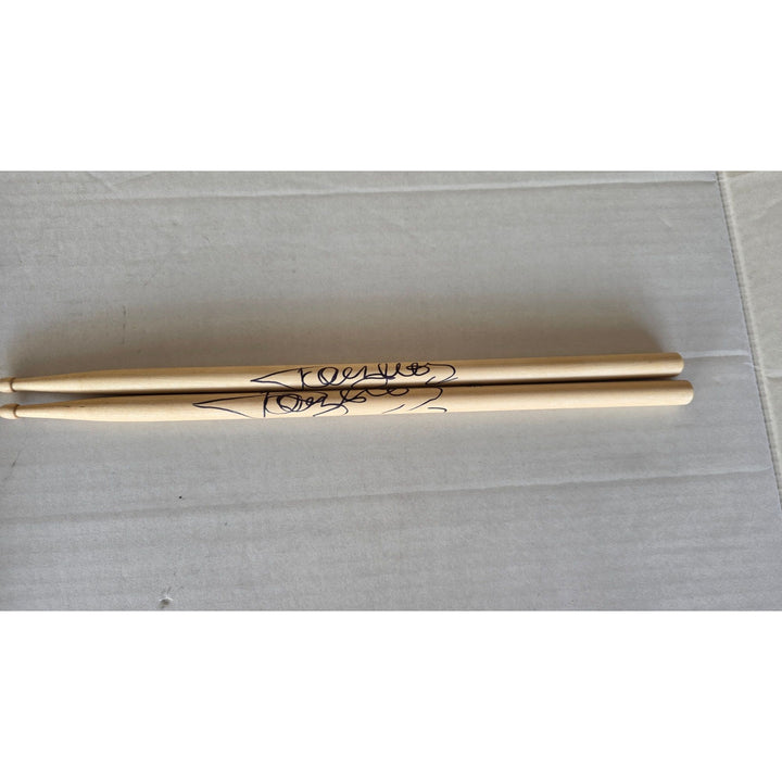 Tommy Lee of Motley Crue pair of drumsticks signed with proof.