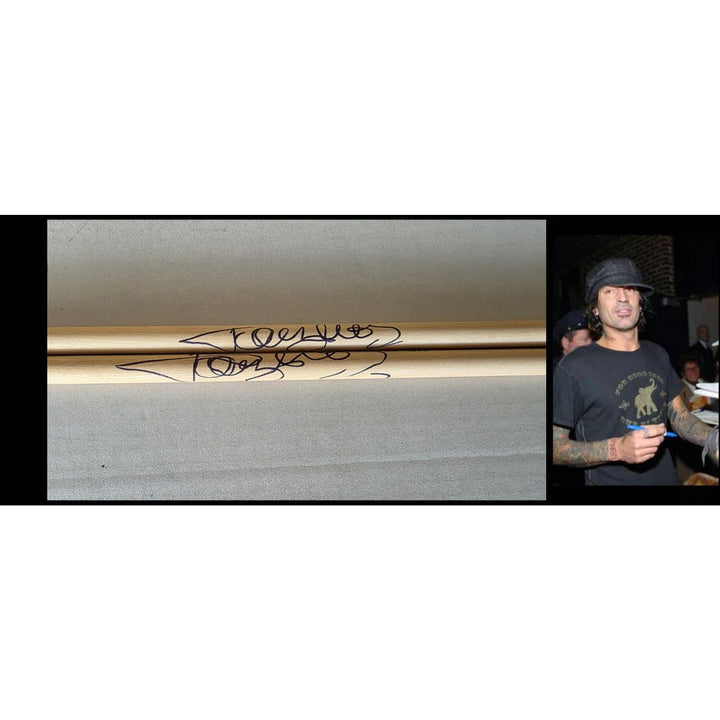 Tommy Lee of Motley Crue pair of drumsticks signed with proof.