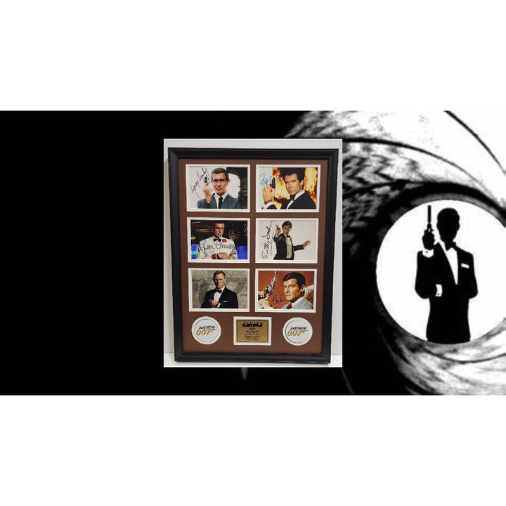 Roger Moore Pierce Brosnan Sean Connery James Bond 007 5x7 photos with Museum quality frame 22x28 signed with proof.
