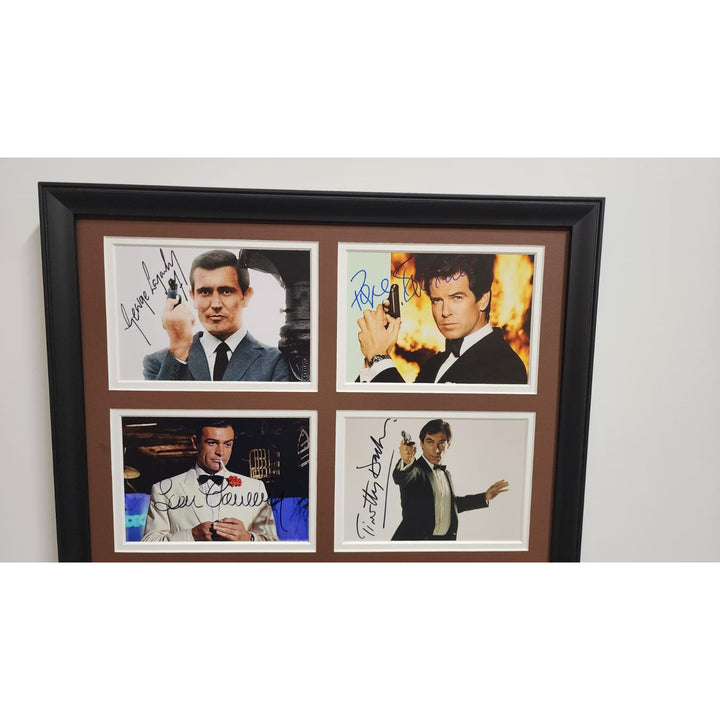 Roger Moore Pierce Brosnan Sean Connery James Bond 007 5x7 photos with Museum quality frame 22x28 signed with proof.