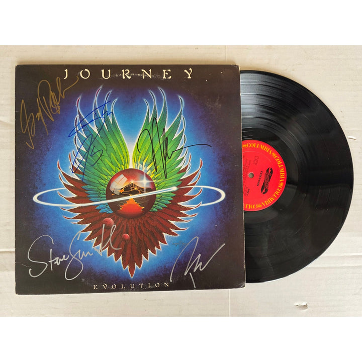 Neal Schon, Ross Valory, Jonathan Cain, Greg Rowley Steve Perry Journey "Evolution" album signed with proof.