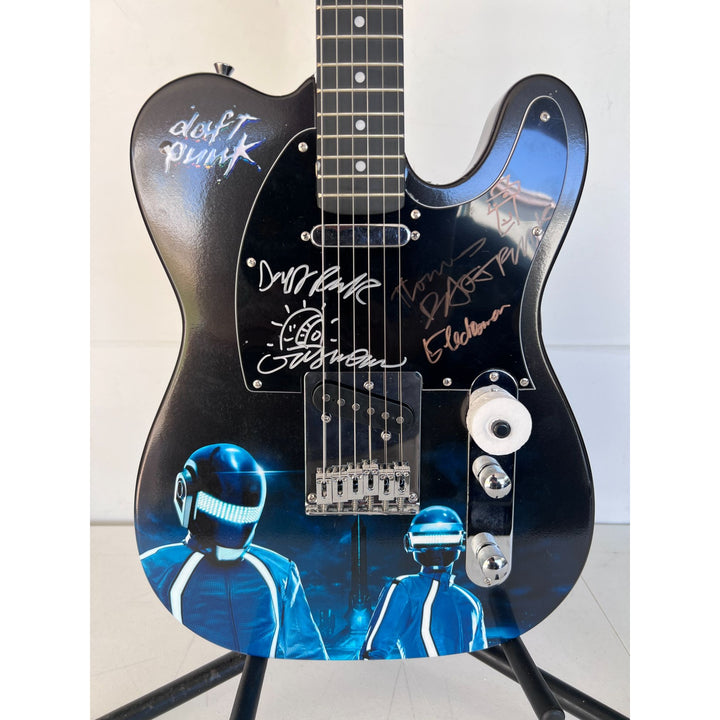 Daft Punk (Thomas Bangalter & Guy Manuel de Homem-Christo) signed with sketch on "One of a Kind" telecaster full size electric guitar.