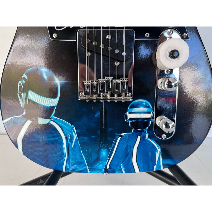Daft Punk (Thomas Bangalter & Guy Manuel de Homem-Christo) signed with sketch on "One of a Kind" telecaster full size electric guitar.