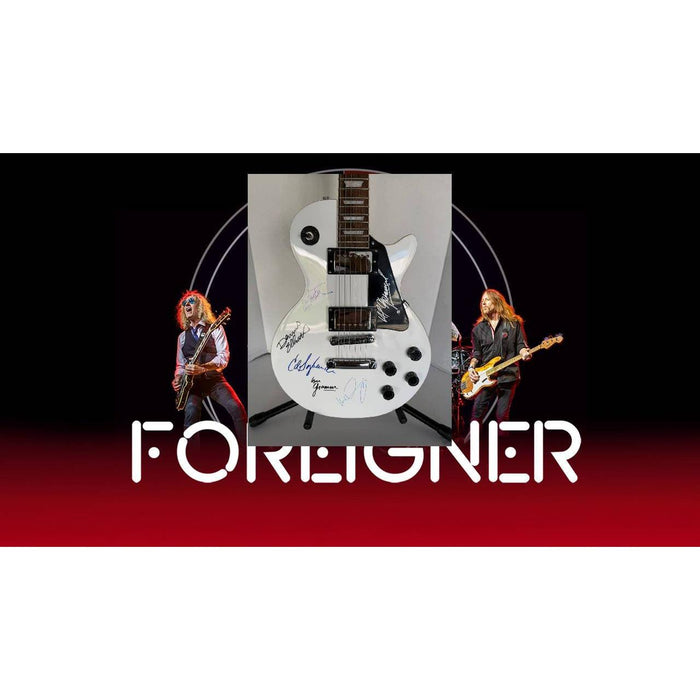 Foreigner les paul electric guitar signed by Mick Jones, Dennis Elliott, Al Greenwood, Lou Gramm, Ian McDonald and Ed Gagliardi.