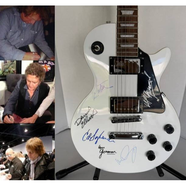 Foreigner les paul electric guitar signed by Mick Jones, Dennis Elliott, Al Greenwood, Lou Gramm, Ian McDonald and Ed Gagliardi.