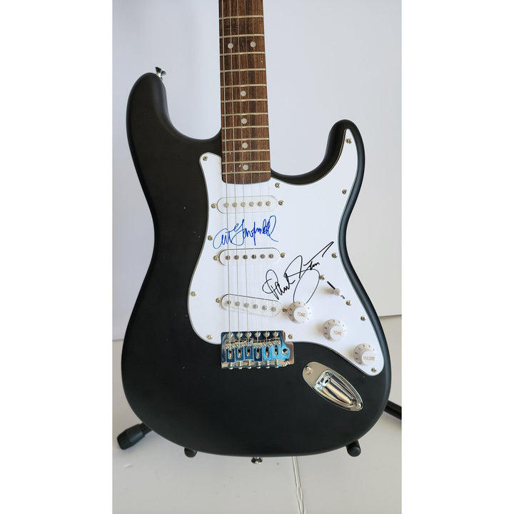Garfunkel & Paul Simon, authentic Fender Stratocaster electric guitar signed with proof