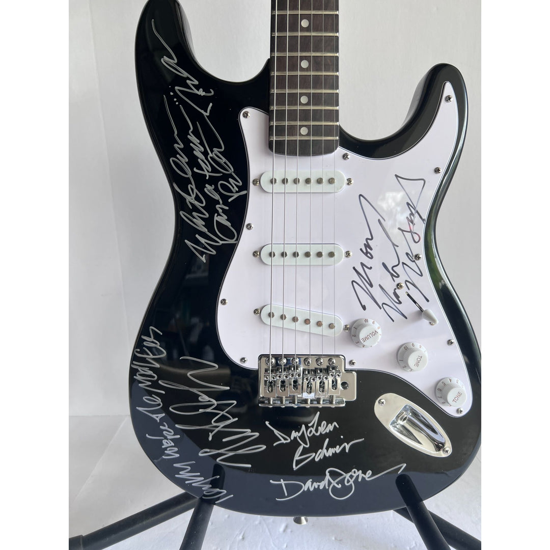 The Monkees Michael Nesmith, Peter Tork, Micky Dolenz, and Davey Jones full size Stratocaster electric guitar signed with proof