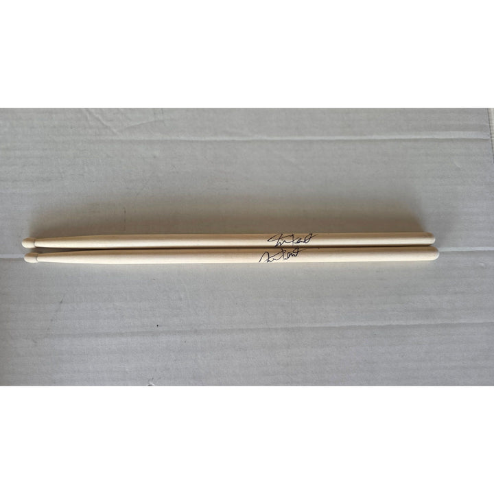 Neil Peart Rush pair of drumsticks signed with proof.