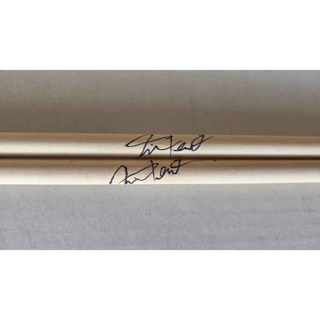 Neil Peart Rush pair of drumsticks signed with proof.