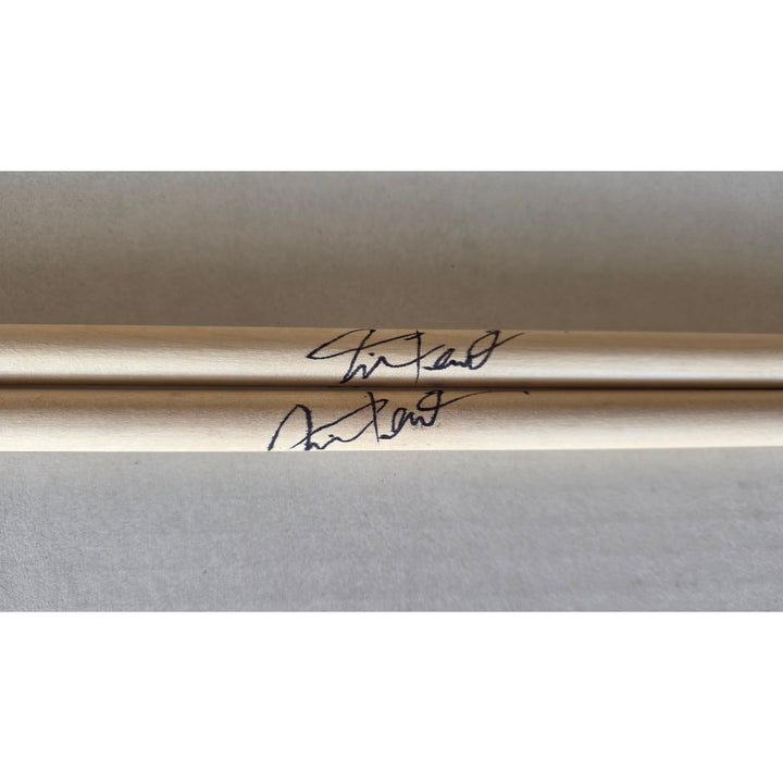 Neil Peart Rush pair of drumsticks signed with proof.