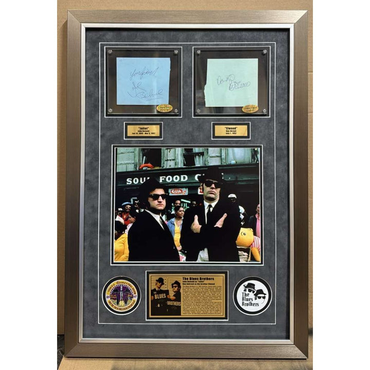 The Blues Brothers Dan Akroyd & John Belushi autograph book page signed with proof & museum quality frame with plexi 25x35.