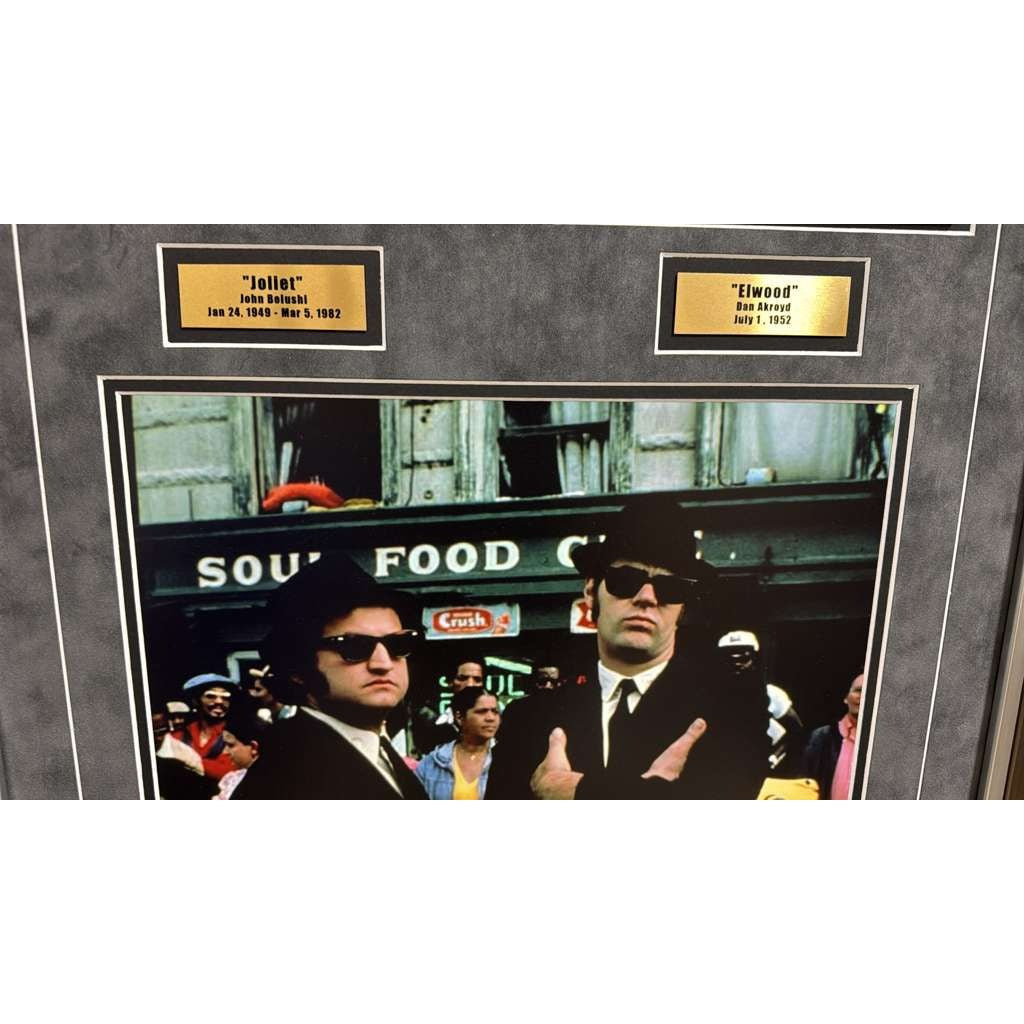 The Blues Brothers Dan Akroyd & John Belushi autograph book page signed with proof & museum quality frame with plexi 25x35.