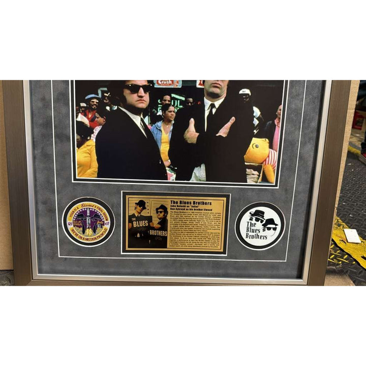The Blues Brothers Dan Akroyd & John Belushi autograph book page signed with proof & museum quality frame with plexi 25x35.