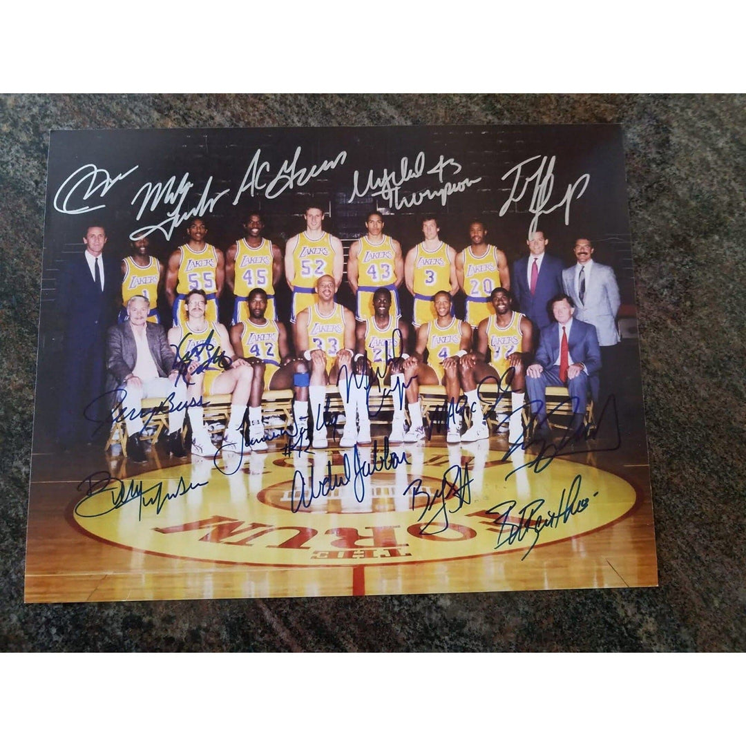 Los Angeles Lakers Earvin Magic Johnson, James Worthy, Jerry Buss team-signed 11 by 14 photo - Awesome Artifacts 