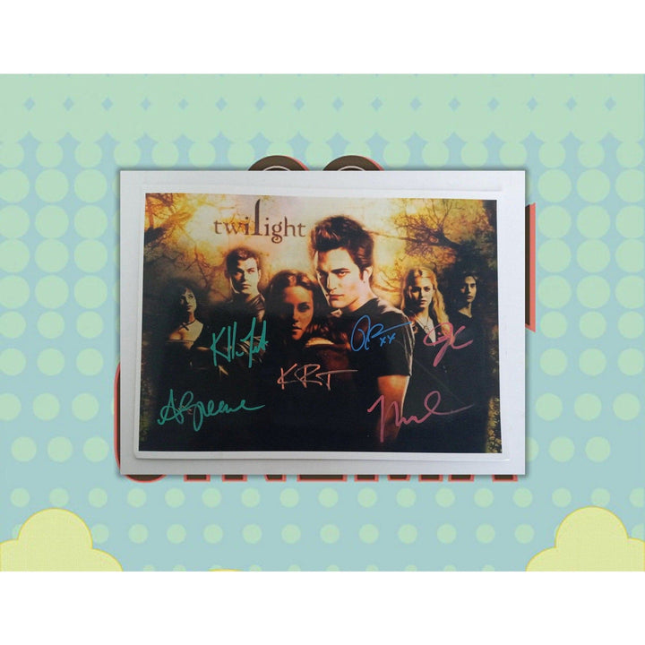 Twilight Robert Pattinson,  Kristen Stewart, Taylor Lautner, Ashley Greene, Kellan Lutz, Nikki Reed 8 by 10 signed photo with proof