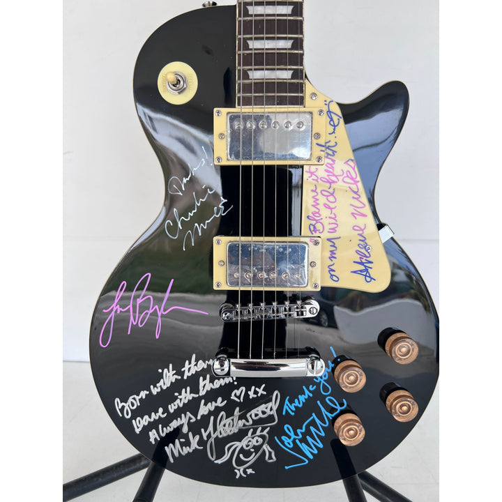 Fleetwood Mac vintage les paul signed by Mick Fleetwood, Christine McVie, John McVie, Stevie Nicks and Lindsey Buckingham signed with proof.