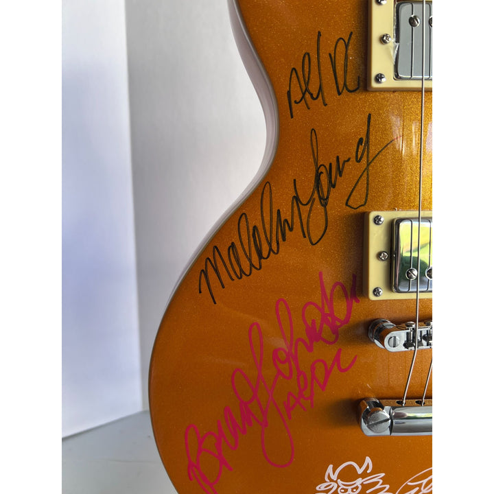 AC/DC Angus Young Brian Johnson Malcolm Young Phil Rudd Les Paul electric guitars signed with proof