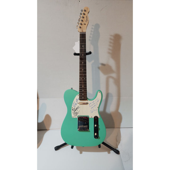 Rush Neil Peart,  Alex Lifeson (inscription), Geddy Lee  original Fender telecaster full size electric guitar signed with proof