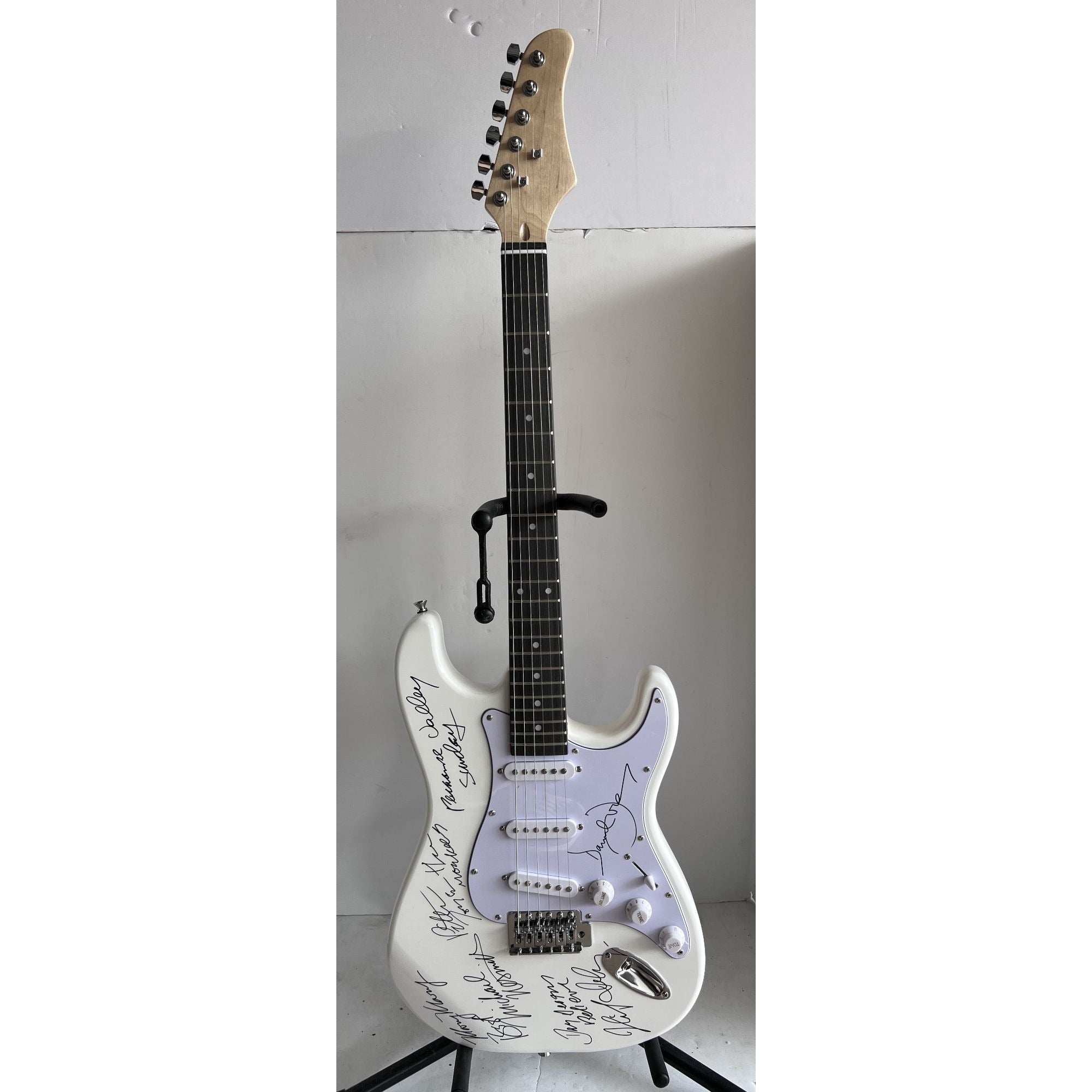 The Monkees Michael Nesmith, Peter Tork, Micky Dolenz, and Davey Jones full size Stratocaster electric guitar signed with proof