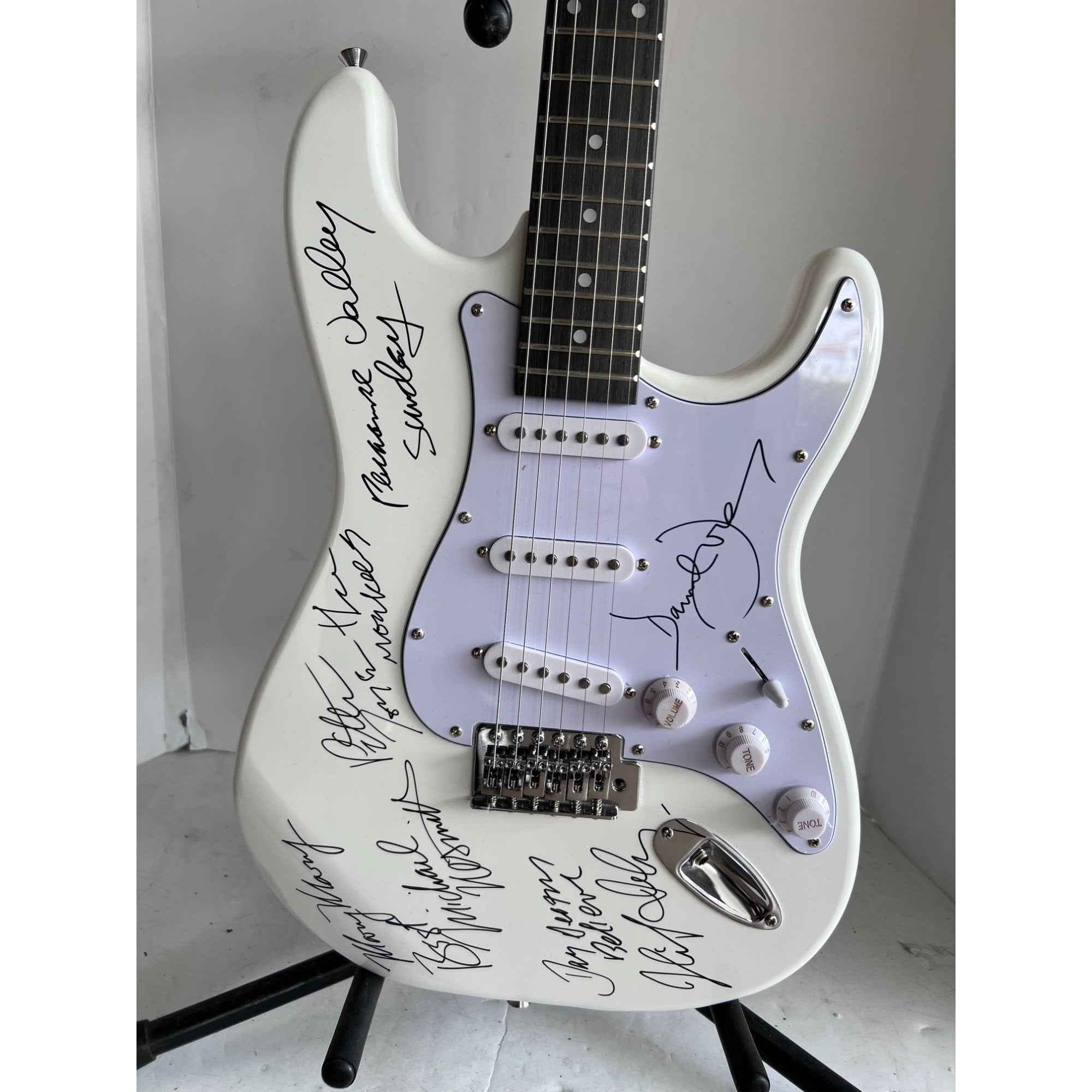 The Monkees Michael Nesmith, Peter Tork, Micky Dolenz, and Davey Jones full size Stratocaster electric guitar signed with proof