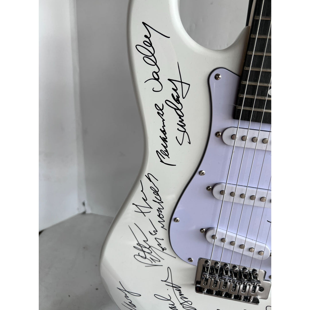 The Monkees Michael Nesmith, Peter Tork, Micky Dolenz, and Davey Jones full size Stratocaster electric guitar signed with proof