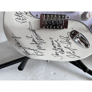 The Monkees Michael Nesmith, Peter Tork, Micky Dolenz, and Davey Jones full size Stratocaster electric guitar signed with proof