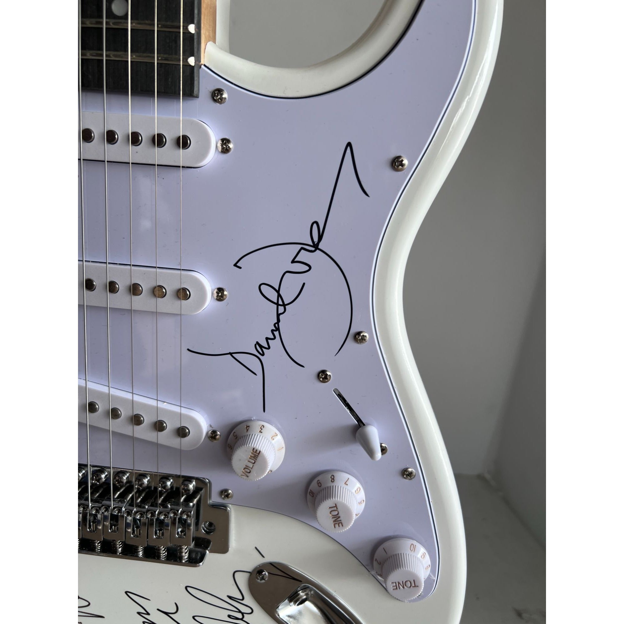 The Monkees Michael Nesmith, Peter Tork, Micky Dolenz, and Davey Jones full size Stratocaster electric guitar signed with proof