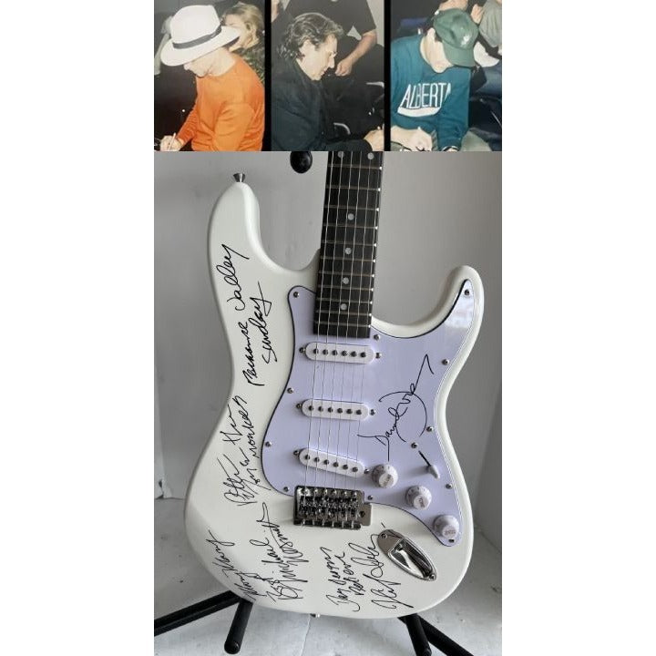 The Monkees Michael Nesmith, Peter Tork, Micky Dolenz, and Davey Jones full size Stratocaster electric guitar signed with proof