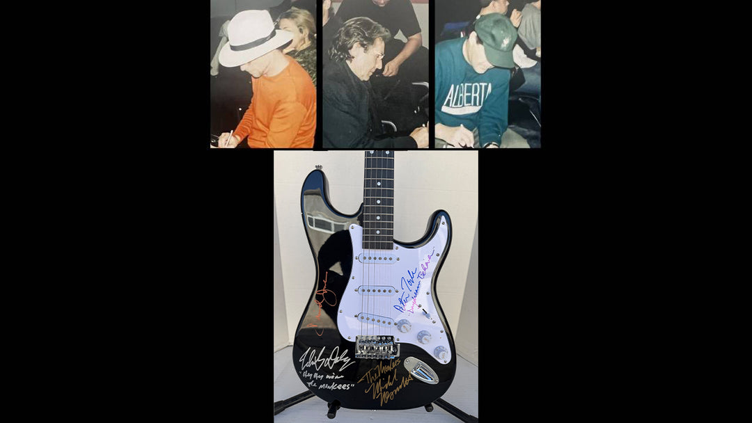 The Monkees Michael Nesmith, Peter Tork, Micky Dolenz, and Davey Jones full size Stratocaster electric guitar signed with proof