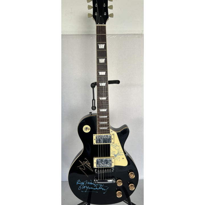 The Who Roger Daltry, Pete Townshend, John Entwhistle full size black les paul guitar signed with proof.