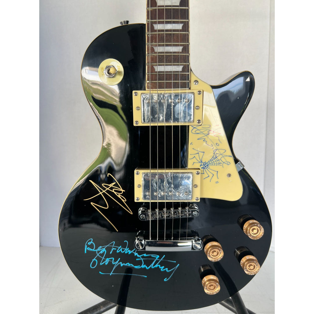 The Who Roger Daltry, Pete Townshend, John Entwhistle full size black les paul guitar signed with proof.