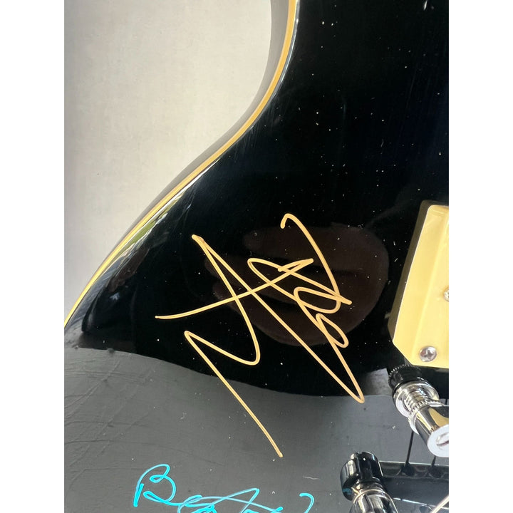 The Who Roger Daltry, Pete Townshend, John Entwhistle full size black les paul guitar signed with proof.