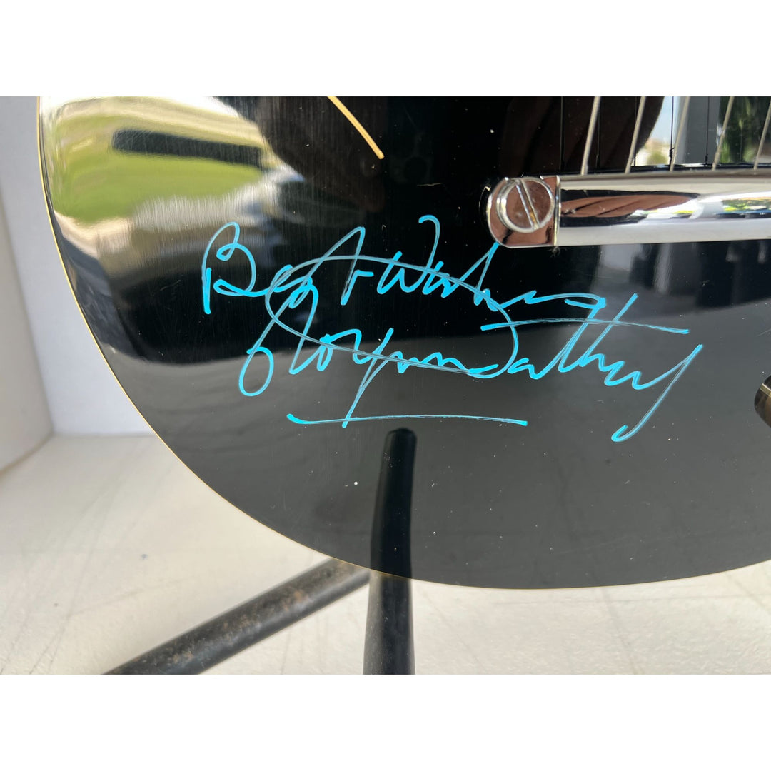 The Who Roger Daltry, Pete Townshend, John Entwhistle full size black les paul guitar signed with proof.