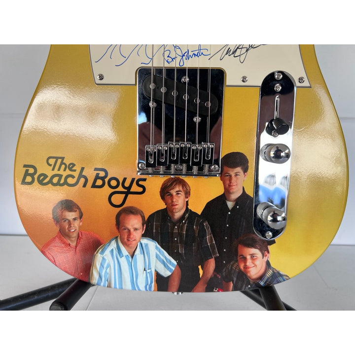 The Beach Boys full size telecaster electric guitar Brian Wilson, Mike Love, Al Jardine, David Marks  Bruce Johnston (sketch, waves) & proof.