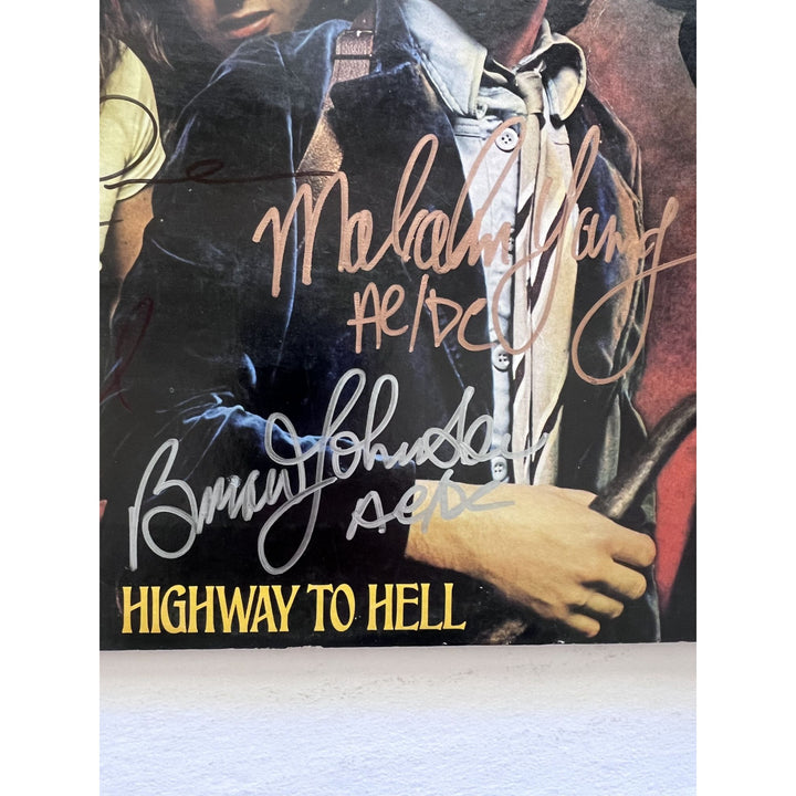 Angus young Malcolm Young Brian Johnson Cliff Williams Phil Rudd AC DC highway to hell lp signed with proof