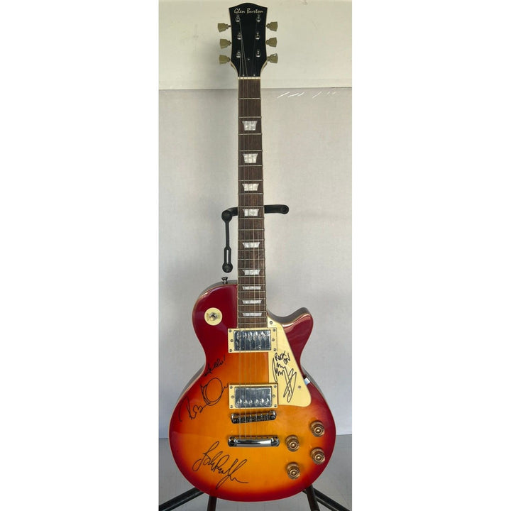 Led Zeppelin Jimmy Page with inscription Rock On! Robert Plant, and John Paul Jones vintage les paul signed with proof.