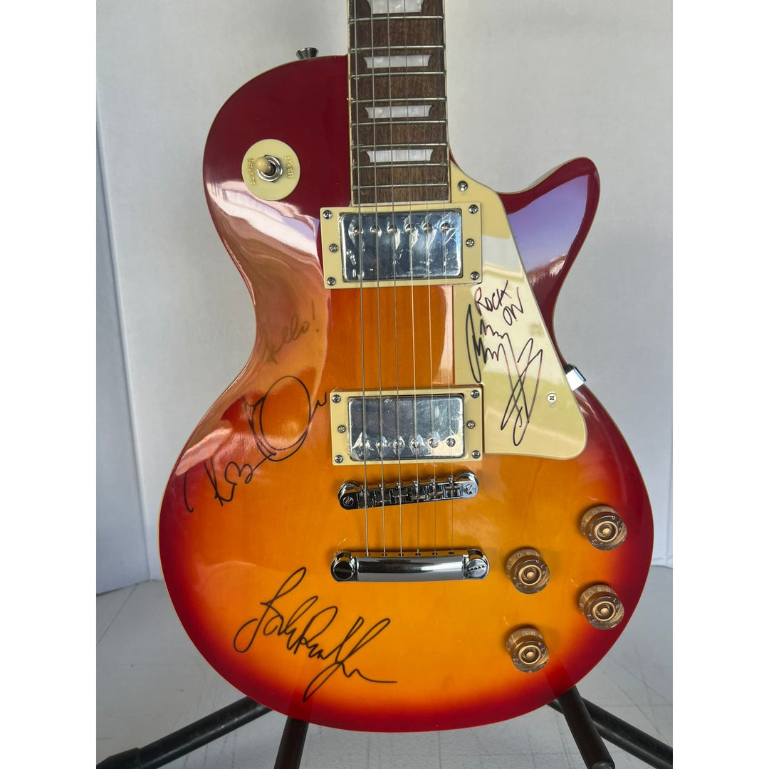 Led Zeppelin Jimmy Page with inscription Rock On! Robert Plant, and John Paul Jones vintage les paul signed with proof.