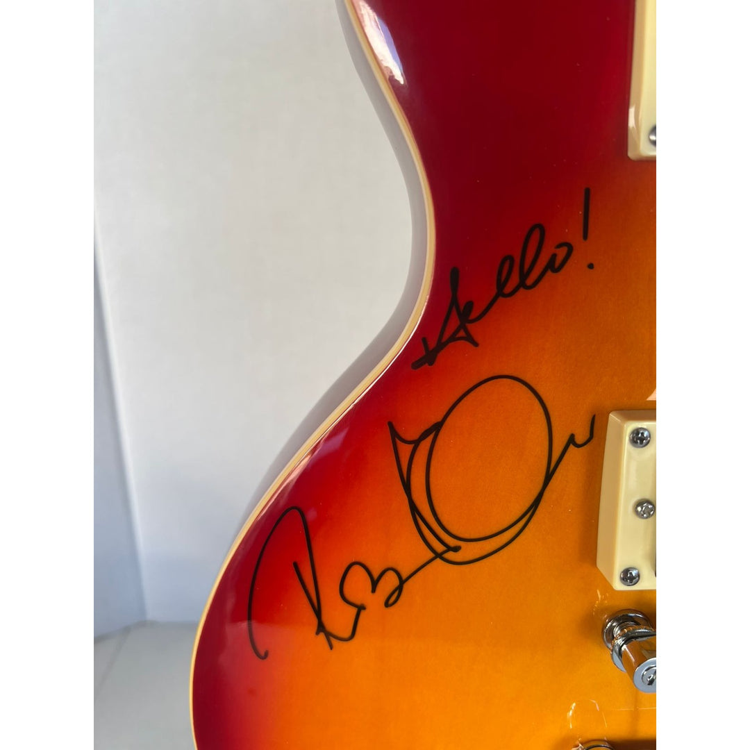 Led Zeppelin Jimmy Page with inscription Rock On! Robert Plant, and John Paul Jones vintage les paul signed with proof.