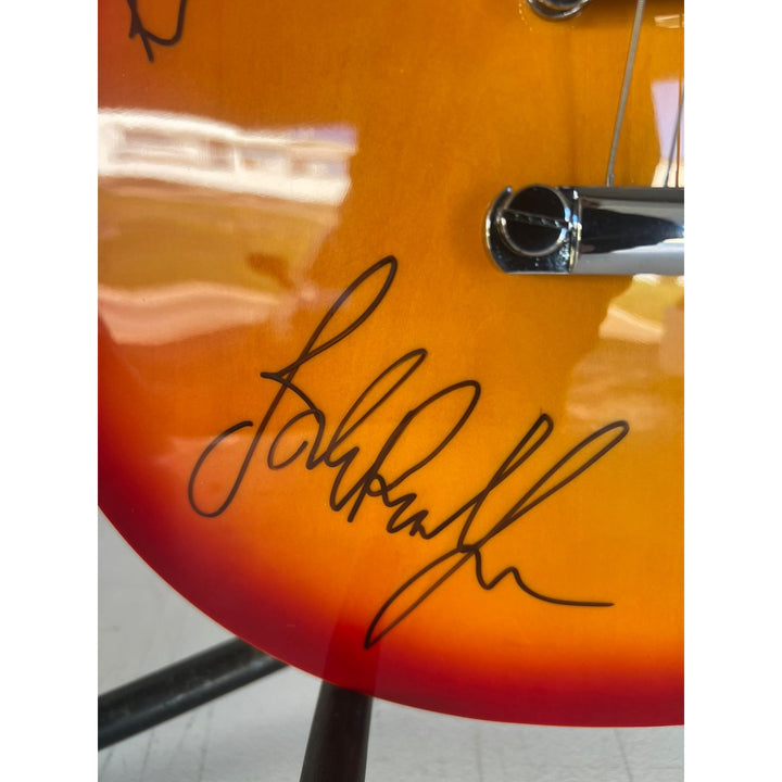 Led Zeppelin Jimmy Page with inscription Rock On! Robert Plant, and John Paul Jones vintage les paul signed with proof.