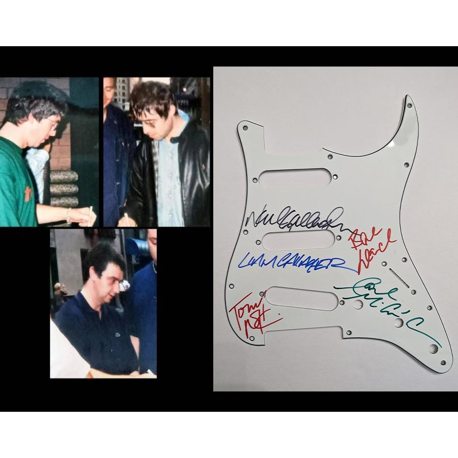 Liam and Noel Gallagher Oasis band signed Fender Stratocaster electric guitar pickguard signed with proof