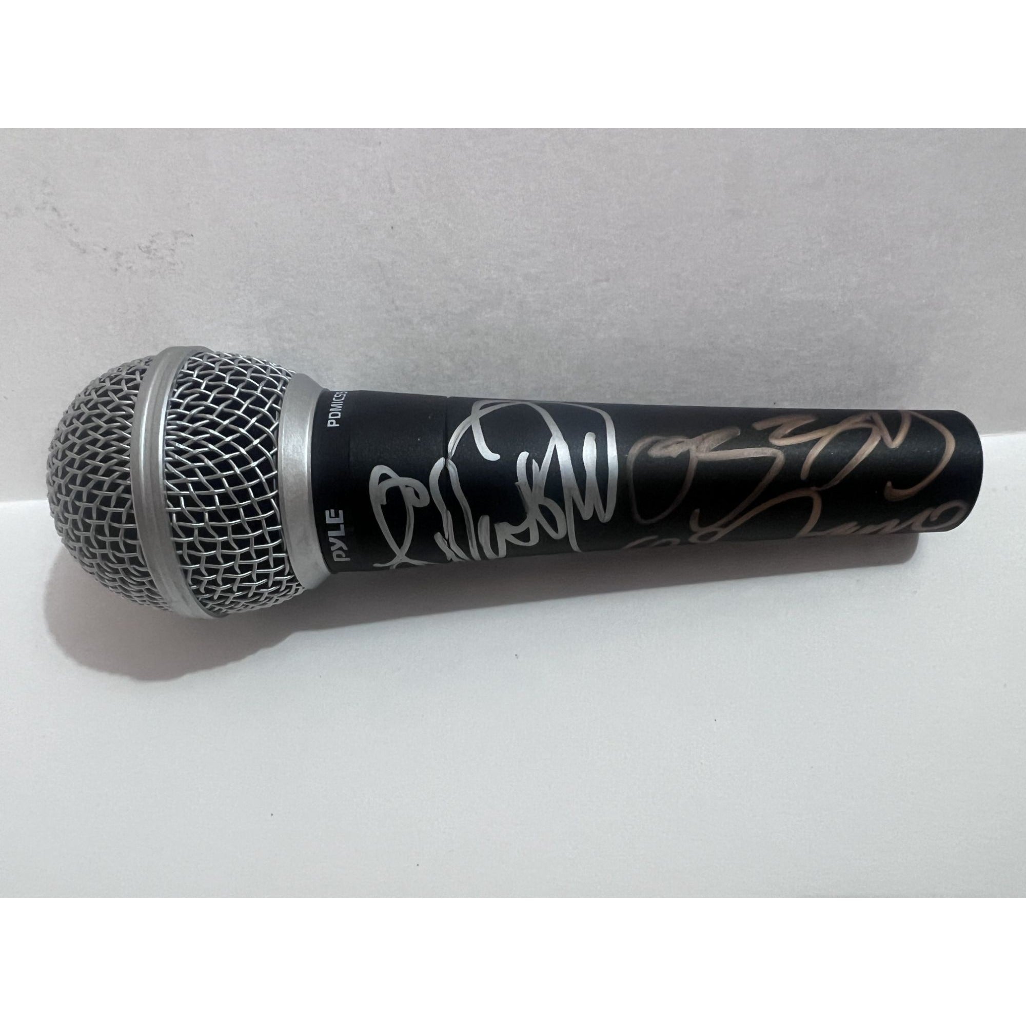 Ozzy Osbourne and Lita Ford microphone signed with proof