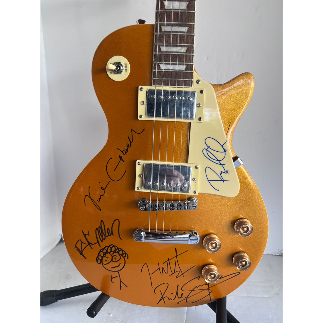 Def Leppard Phil Collen, Vivian Campbell, Joe Elliott, Rick Savage, Rick Allen. Gold Les Paul electric guitar signed with proof