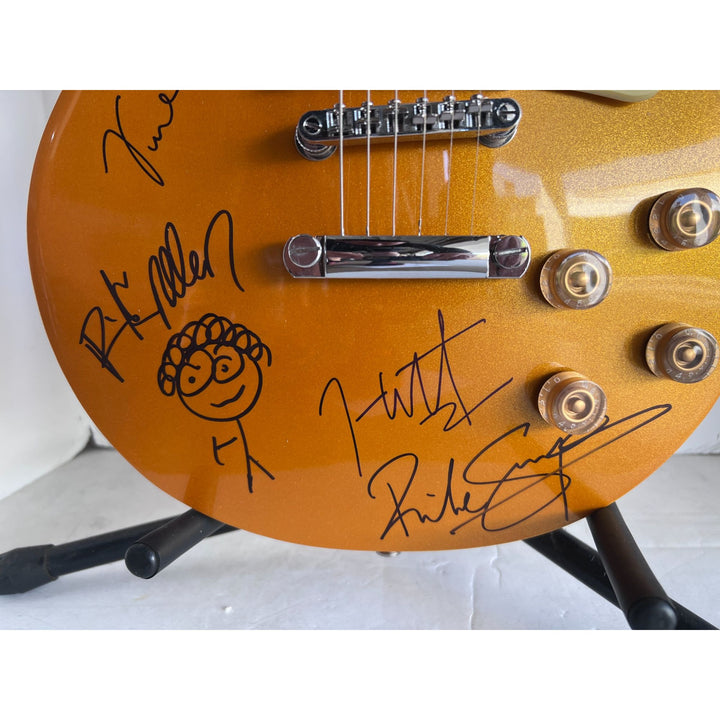 Def Leppard Phil Collen, Vivian Campbell, Joe Elliott, Rick Savage, Rick Allen. Gold Les Paul electric guitar signed with proof