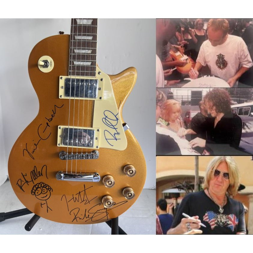 Def Leppard Phil Collen, Vivian Campbell, Joe Elliott, Rick Savage, Rick Allen. Gold Les Paul electric guitar signed with proof