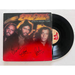 Load image into Gallery viewer, Barry, Robin and Maurice Gibb the Bee Gees Spirits Having Flown original LP signed with proof
