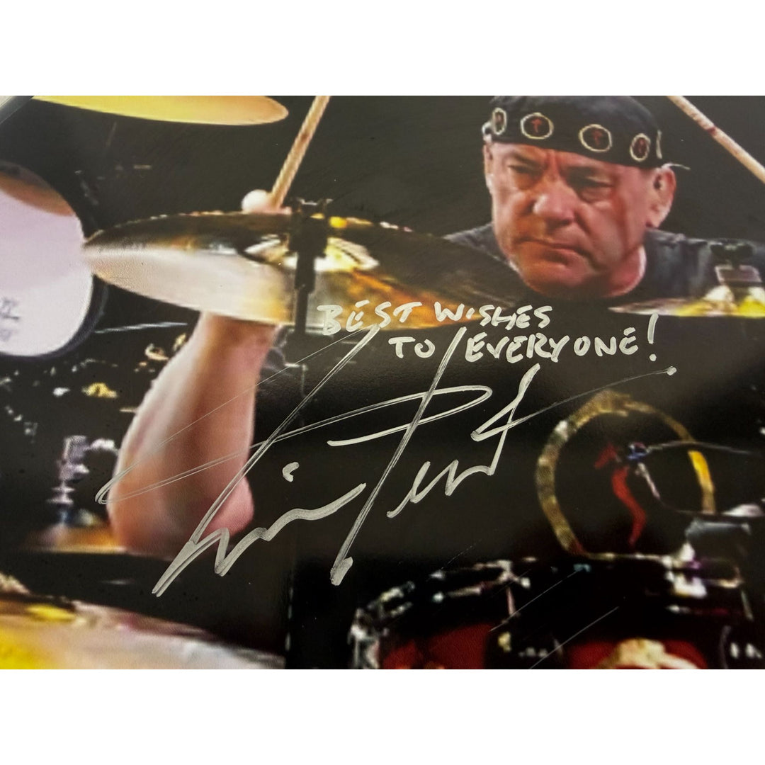 Neil Peart Rushs' iconic drummer drumhead signed with proof.