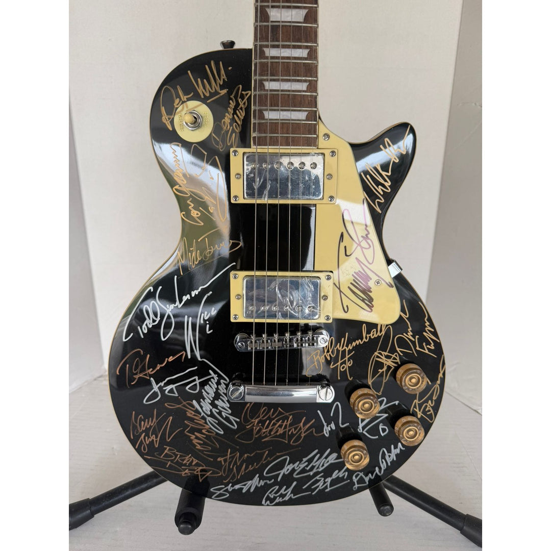 Foreigner Boston, Toto, Steely Dan, Kansas, Styx, Boz Scaggs, Steve Miller black Les Paul electric guitar signed with proof.