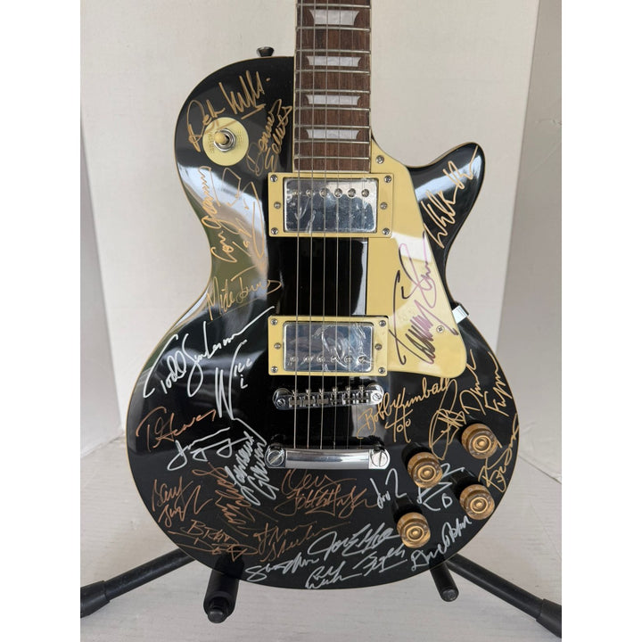 Foreigner Boston, Toto, Steely Dan, Kansas, Styx, Boz Scaggs, Steve Miller black Les Paul electric guitar signed with proof.
