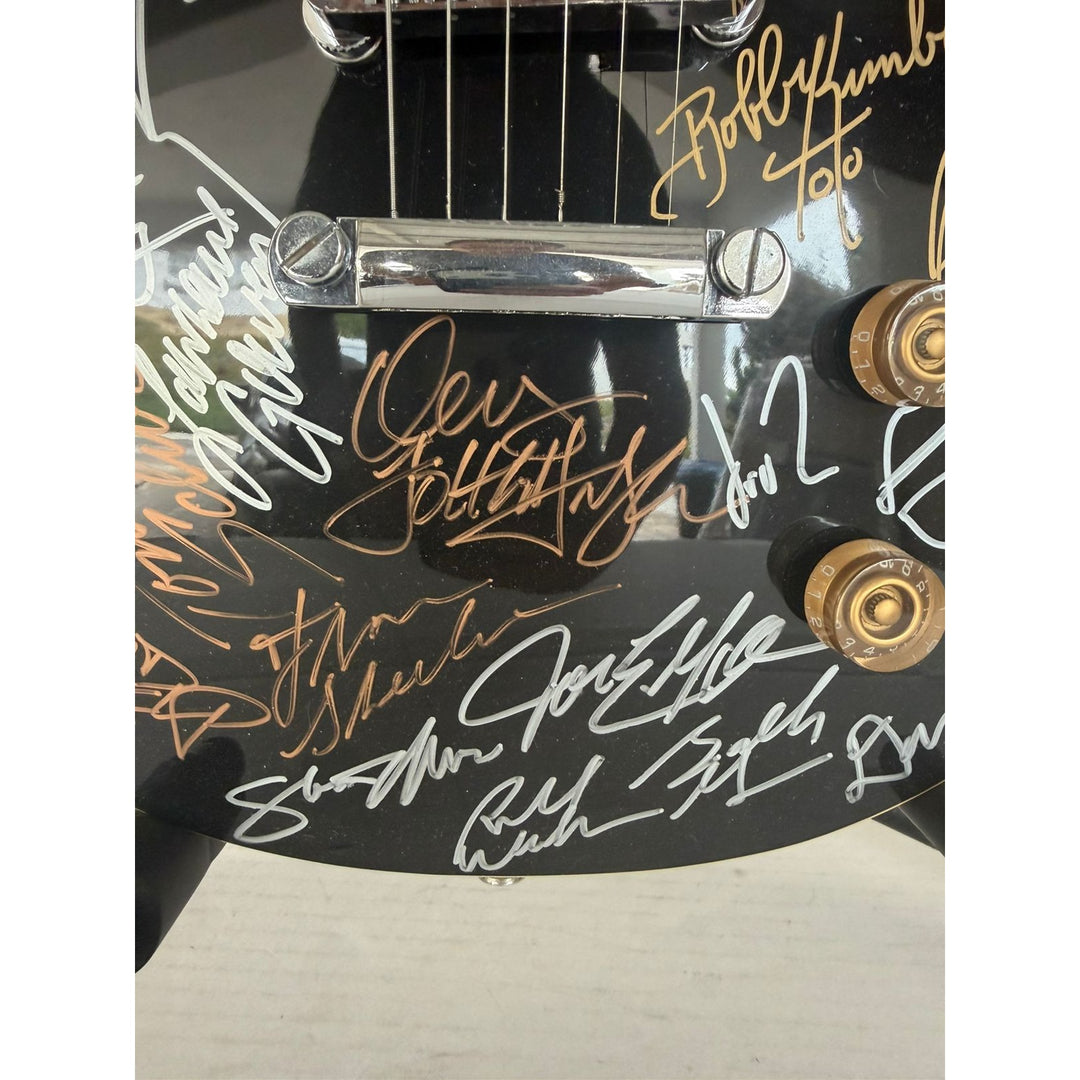 Foreigner Boston, Toto, Steely Dan, Kansas, Styx, Boz Scaggs, Steve Miller black Les Paul electric guitar signed with proof.