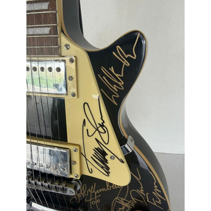 Foreigner Boston, Toto, Steely Dan, Kansas, Styx, Boz Scaggs, Steve Miller black Les Paul electric guitar signed with proof.